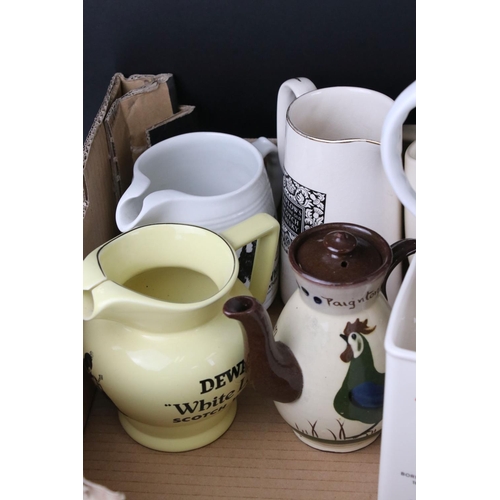 64 - A quantity of vintage ceramic pub advertising water jugs.