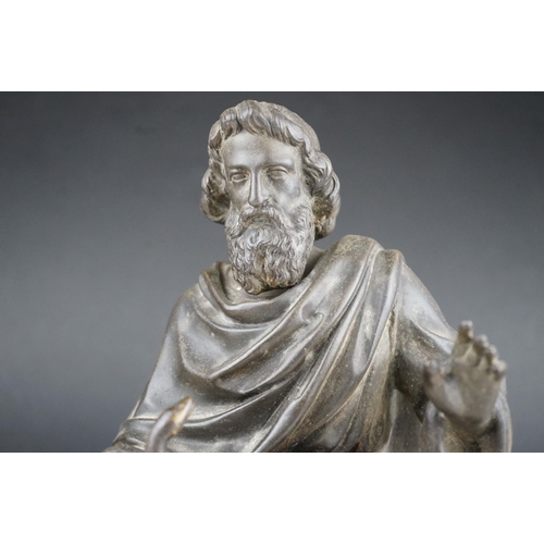 34 - Metal sculpture of a seated bearded man holding snake believed to be the Greek God Asclepius.