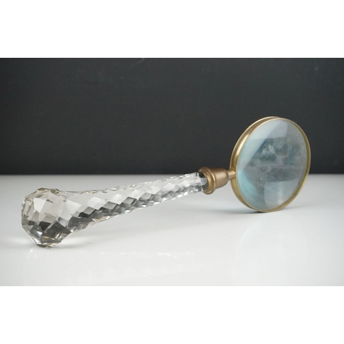 51 - A large glass handled vintage magnifier, 33 cm long.