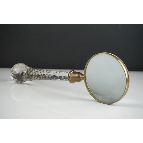 51 - A large glass handled vintage magnifier, 33 cm long.