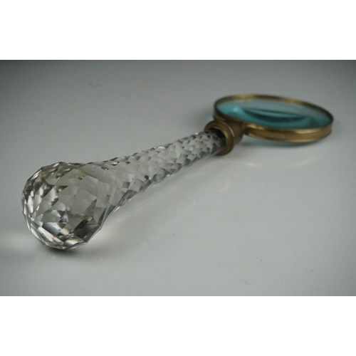 51 - A large glass handled vintage magnifier, 33 cm long.