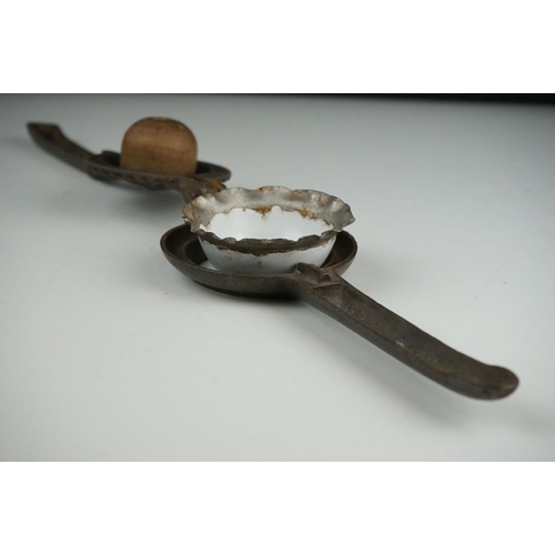 54 - An early 20th century cast iron Lemon Squeezer with insert.