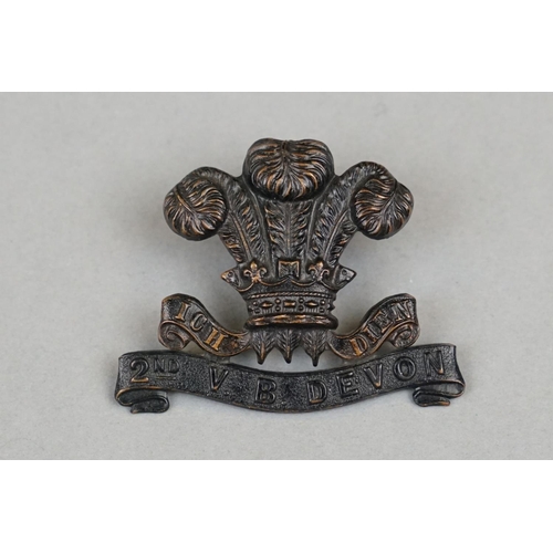 14 - A British Military The 2nd Volunteer Battalion Of The Devon Regiment Bronzed Brass Cap Badge, Twin L... 