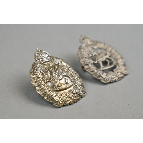 23 - A British Military Pair Of 1st Battalion Of The Monmouthshire Regiment White Metal Cap Badges With K... 