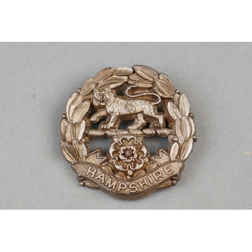 24 - A British Military The Hampshire Regiment World War Two Plastic Economy Cap Badge With Twin Strap Fi... 