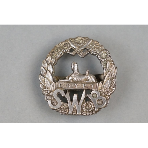 28 - A British Military The South Wales Border Regiment White Metal (Silver) Officers Cap Badge With Twin... 