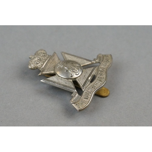 35 - A British Military The Wiltshire Regiment White Metal Cap Badge With Brass Slider Fixing To Verso Ma... 