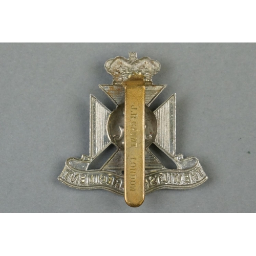 35 - A British Military The Wiltshire Regiment White Metal Cap Badge With Brass Slider Fixing To Verso Ma... 