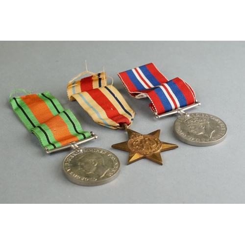 46 - A British World War Two Full Size Medal Group Of Three To Include The 1939-1945 British War Medal, T... 