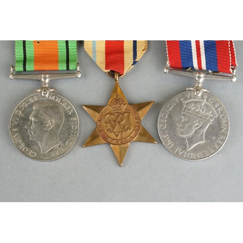 46 - A British World War Two Full Size Medal Group Of Three To Include The 1939-1945 British War Medal, T... 