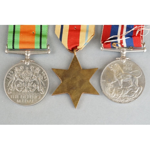 46 - A British World War Two Full Size Medal Group Of Three To Include The 1939-1945 British War Medal, T... 