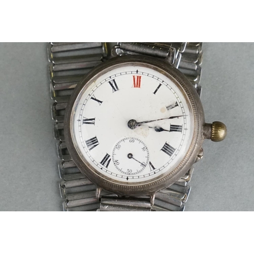 52 - A World War One Era Trench Watch, White Enamel Dial With Subsidiary Second Hand To The 6 O'Clock Pos... 