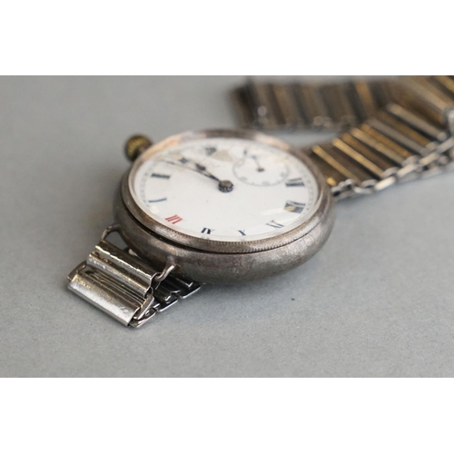 52 - A World War One Era Trench Watch, White Enamel Dial With Subsidiary Second Hand To The 6 O'Clock Pos... 