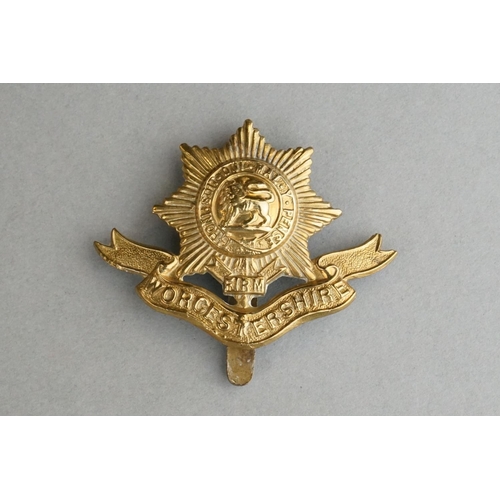 76 - A British Military The Worcestershire Regiment Brass Cap Badge With Slider Fixing To Verso Together ... 