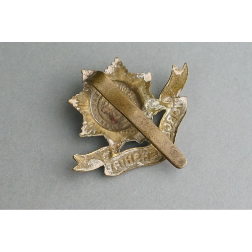 76 - A British Military The Worcestershire Regiment Brass Cap Badge With Slider Fixing To Verso Together ... 