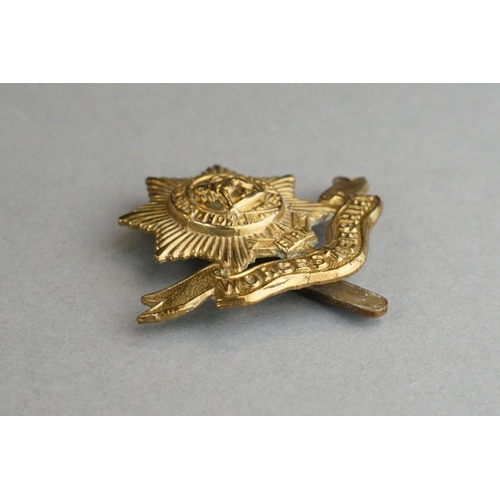 76 - A British Military The Worcestershire Regiment Brass Cap Badge With Slider Fixing To Verso Together ... 