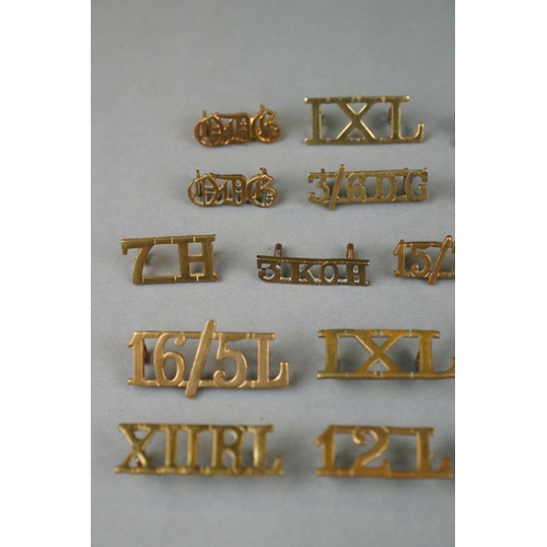 138 - A Collection Of Approx 20 x British Military Brass Lancers And Hussars Shoulder Titles.