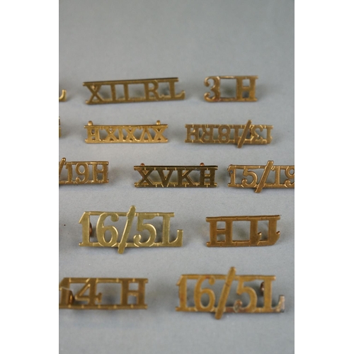 138 - A Collection Of Approx 20 x British Military Brass Lancers And Hussars Shoulder Titles.