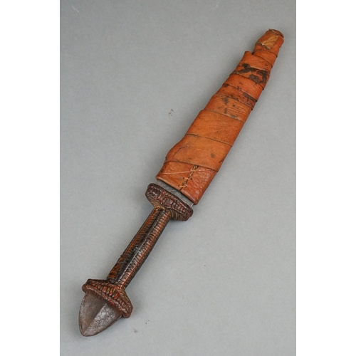 121 - A Vintage African Dagger With Stitch Detailing To Blade Together With Original Leather Sheath.