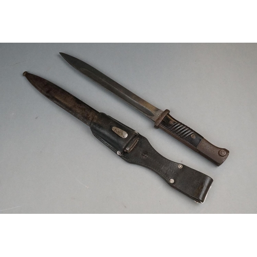 152 - A World War Two German K-98 Bayonet Complete With Matching Numbers Scabbard And Leather Frog.