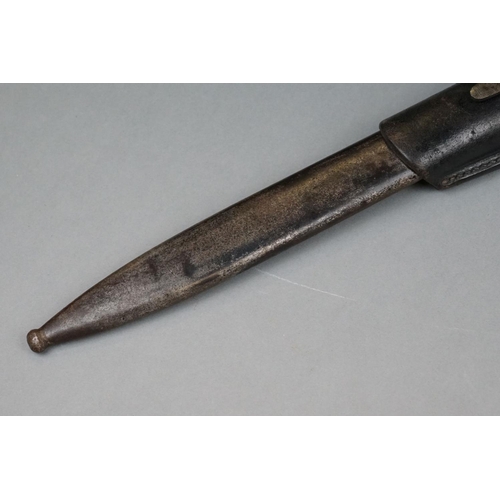 152 - A World War Two German K-98 Bayonet Complete With Matching Numbers Scabbard And Leather Frog.