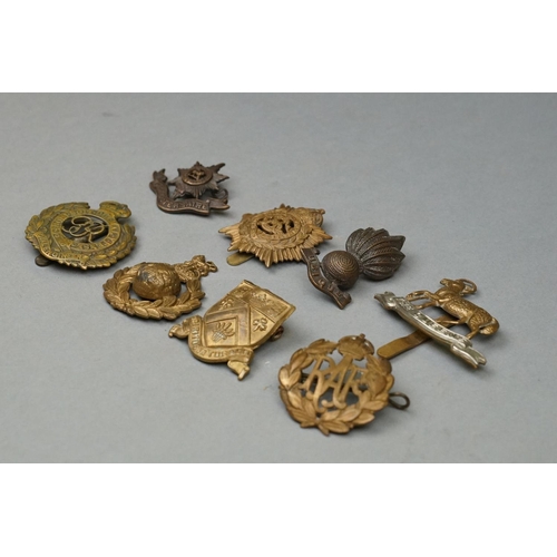 162 - A Small Collection Of British Military Cap Badges To Include The Worcestershire Regiment, The Army S... 