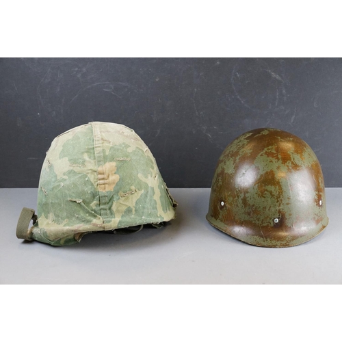 166 - A Military Helmet Complete With Original Liner And Outer Camouflage Cover.