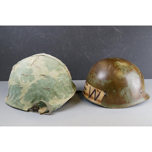 166 - A Military Helmet Complete With Original Liner And Outer Camouflage Cover.