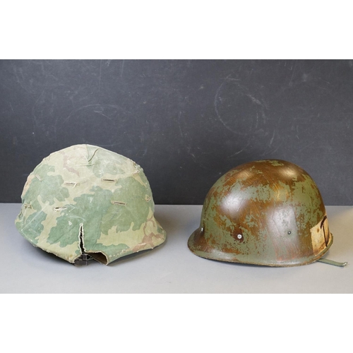 166 - A Military Helmet Complete With Original Liner And Outer Camouflage Cover.