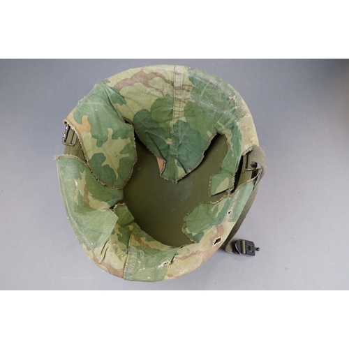 166 - A Military Helmet Complete With Original Liner And Outer Camouflage Cover.