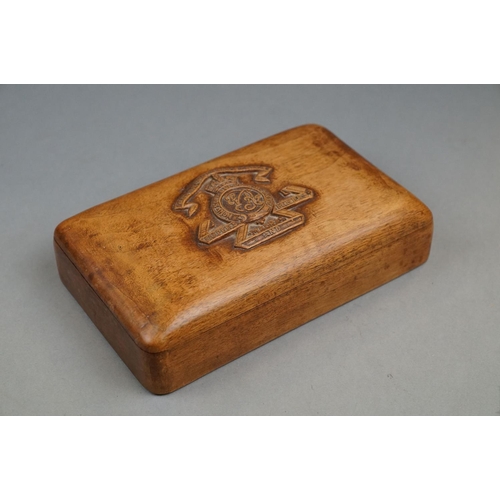 253 - A Wooden Cigarette Box With Carved Lid Badged To The Queen Victoria's Own Madras Sappers And Miners ... 