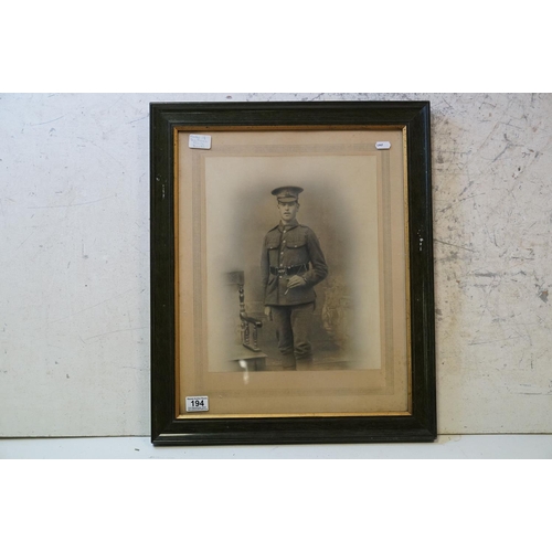 194 - A Large World War One Framed And Glazed Photograph Of A Soldier In Uniform, Measures Approx 59cm x 4... 