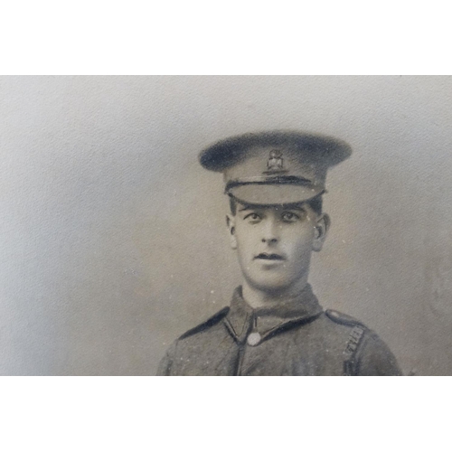 194 - A Large World War One Framed And Glazed Photograph Of A Soldier In Uniform, Measures Approx 59cm x 4... 