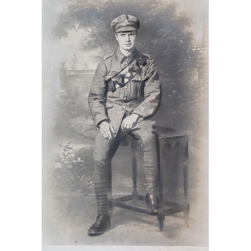 195 - A Large World War One Card Mounted Photograph Of A Soldier In Uniform With Leather Bandolier. Measur... 