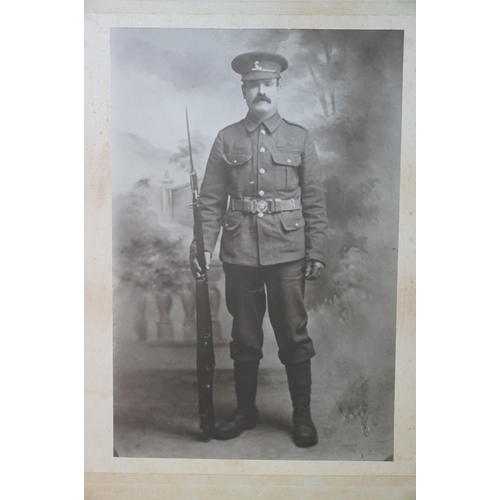 196 - A Large World War One Card Mounted Photograph Of A Soldier (William Rose Of Devizes) In Regimental U... 