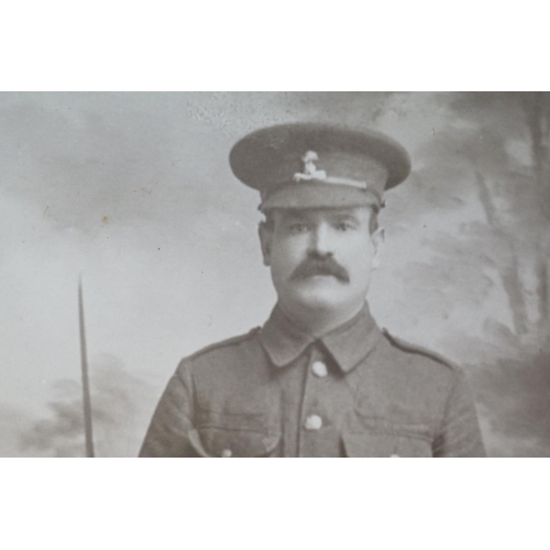 196 - A Large World War One Card Mounted Photograph Of A Soldier (William Rose Of Devizes) In Regimental U... 