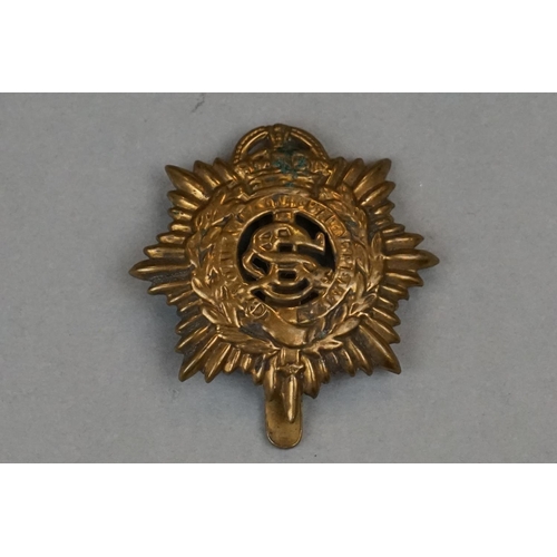 352 - A Small Group Of Military Collectables To Include A Brass Army Service Corps Cap Badge, A Trench Art... 