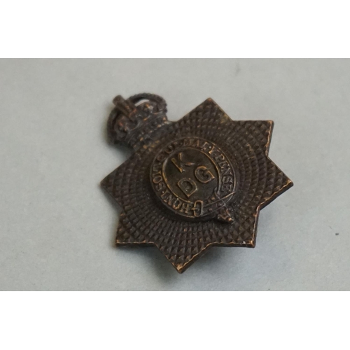 203 - A British Military Kings Dragoon Guards OSD Cap Badge With Kings Crown, Twin Blade Fixings To Verso.