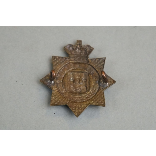 205 - A British Military East Surrey Regiment Bronze Cap Badge With Queen Victoria Crown, Twin Loop Fixing... 