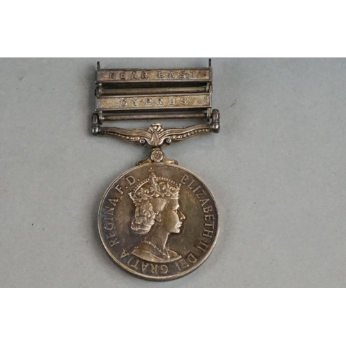 226 - A British Full Size Military General Service Medal (GSM) With Two Clasps To Include The Near East An... 