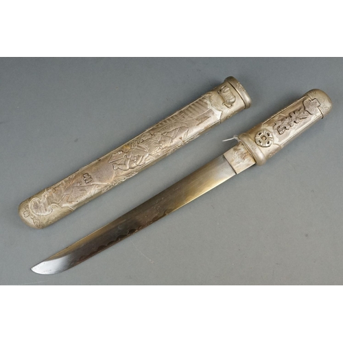 229 - A White Metal Japanese Tanto Short Sword, Decorative Handle And Sheath With Figural Erotic Scenes.