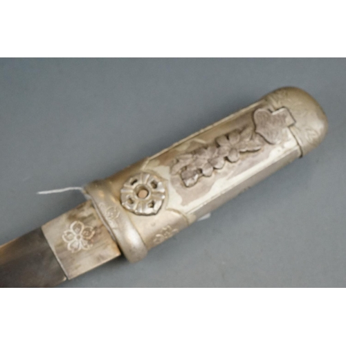 229 - A White Metal Japanese Tanto Short Sword, Decorative Handle And Sheath With Figural Erotic Scenes.