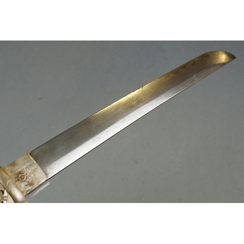 229 - A White Metal Japanese Tanto Short Sword, Decorative Handle And Sheath With Figural Erotic Scenes.