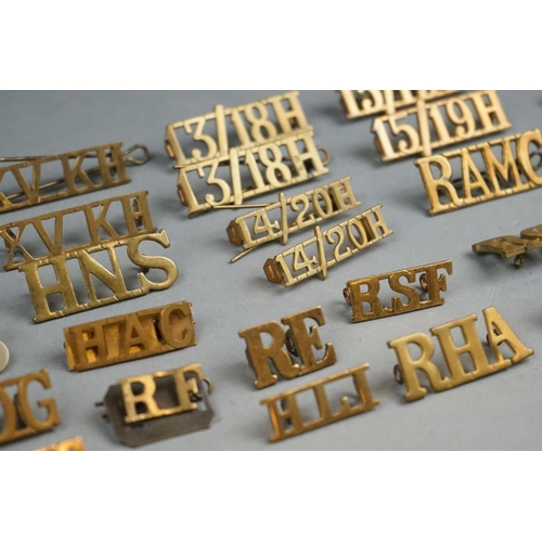 68A - A Collection Of Approx Thirty Assorted British Brass Shoulder Titles To Include The North Lancashire... 