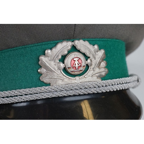 314 - A East German Military Border Guards Peaked Cap Complete With Original Cap Badge.