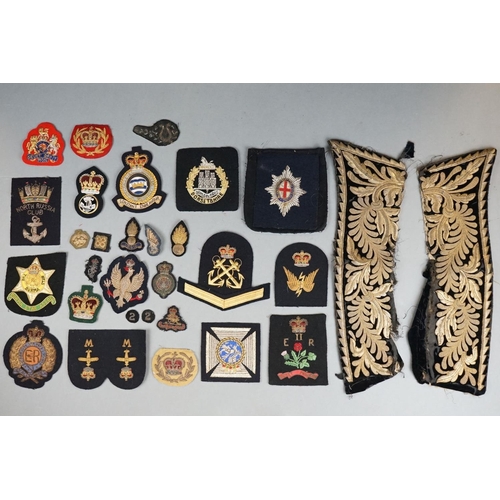 371 - A Large Collection Of Mainly British Military Gold And Silver Embroidered Regimental Cloth Badges.