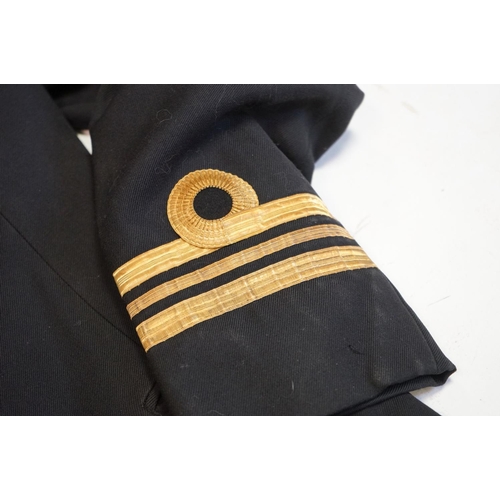 419 - A British Royal Navy Regimental Jacket Complete With Naval Buttons And Cuffs.