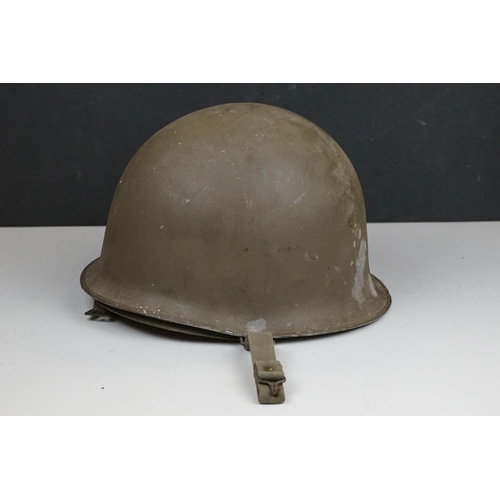 423 - A United States M1 Military Helmet Complete With Liner And Strap.