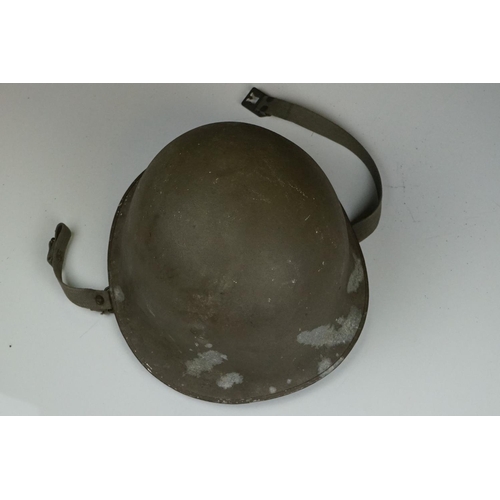 423 - A United States M1 Military Helmet Complete With Liner And Strap.