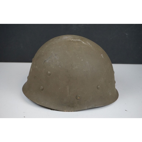 423 - A United States M1 Military Helmet Complete With Liner And Strap.